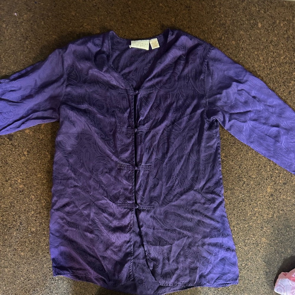 A women’s small, silk night gown. Long sleeves dark purple.